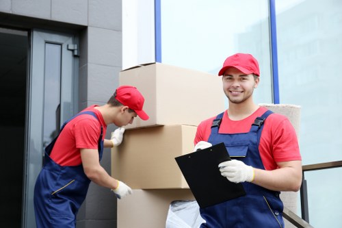 Moving van and packed boxes during a home move in Enfield