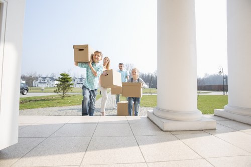 Professional movers loading furniture into a removal van