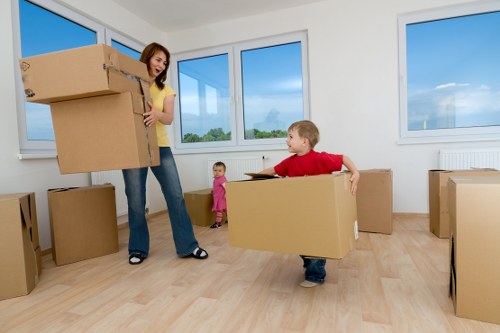 Man with van removal service loading furniture in Enfield