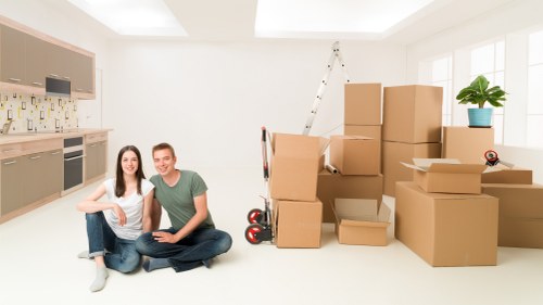 Commercial moving team packing office furniture and equipment