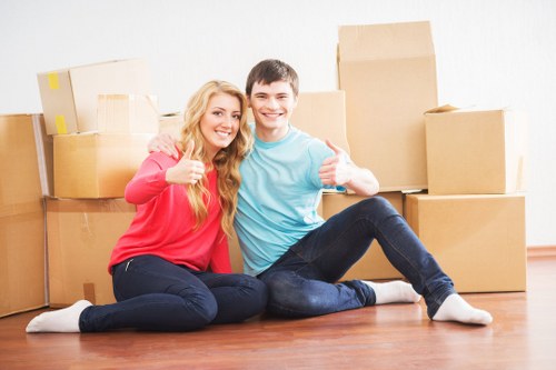 Professional movers loading items for an Enfield relocation