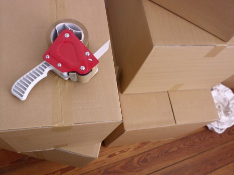 Packed moving boxes and furniture ready for transport